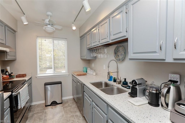 kitchen featuring a sink, gray cabinetry, ceiling fan, and appliances with stainless steel finishes