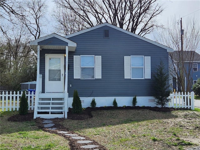 view of front of house featuring crawl space and fence