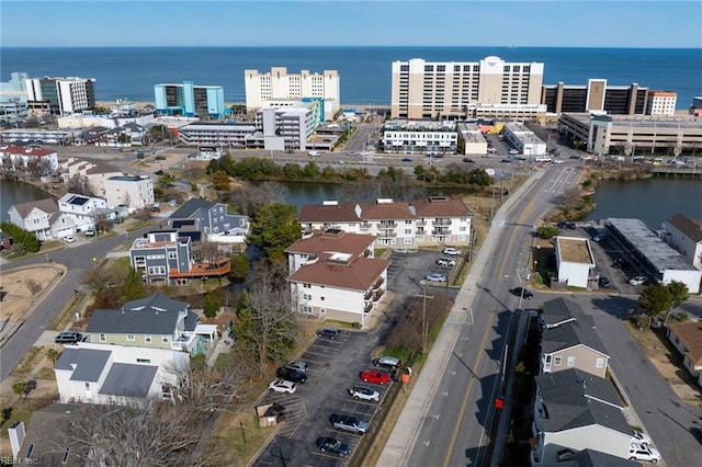 birds eye view of property featuring a water view and a city view