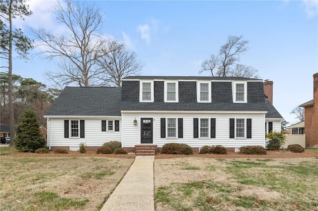 dutch colonial with roof with shingles and a front lawn