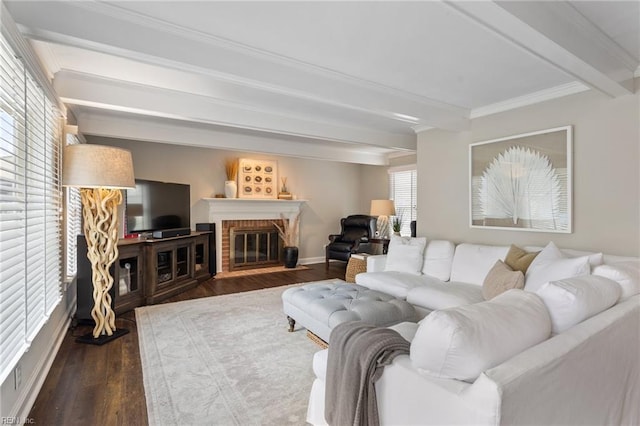 living room featuring a fireplace, crown molding, beamed ceiling, and wood finished floors