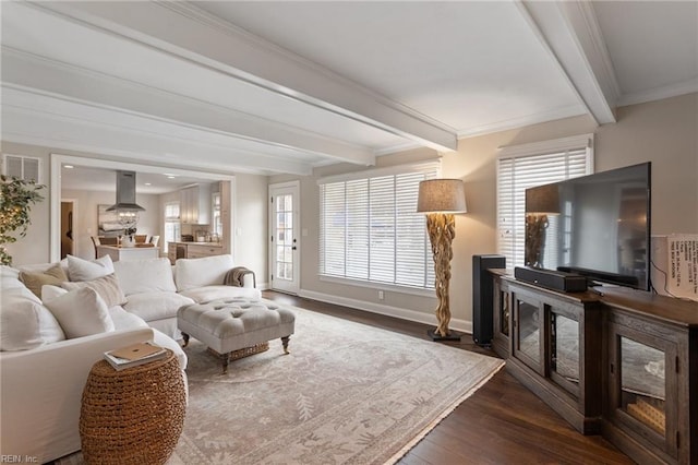 living room featuring beam ceiling, baseboards, dark wood-style flooring, and ornamental molding