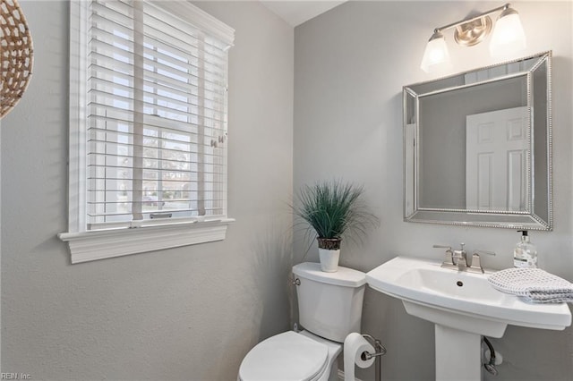 bathroom featuring a sink and toilet