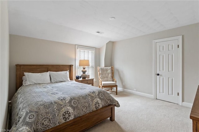 bedroom with vaulted ceiling, visible vents, baseboards, and carpet floors