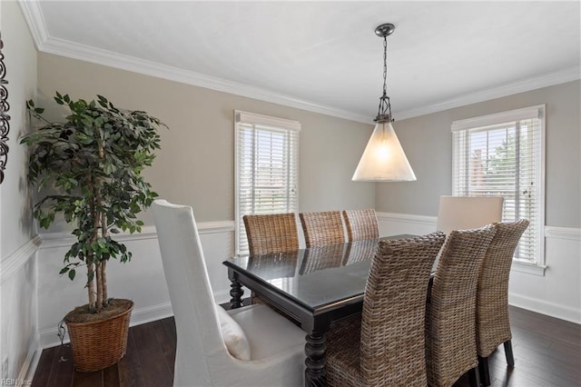 dining area featuring plenty of natural light, dark wood-style flooring, and ornamental molding