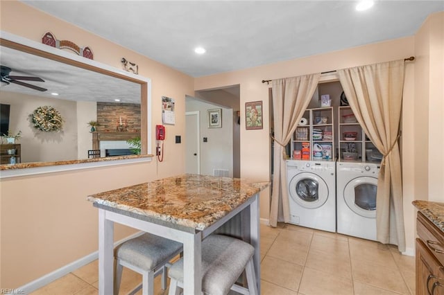 washroom featuring recessed lighting, light tile patterned floors, ceiling fan, laundry area, and washing machine and clothes dryer