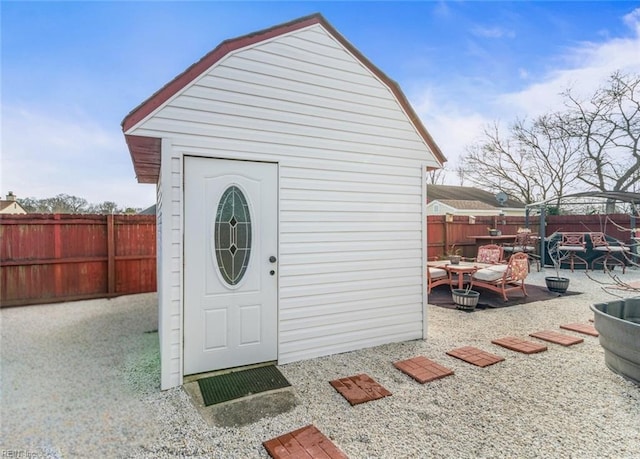 view of shed featuring a fenced backyard