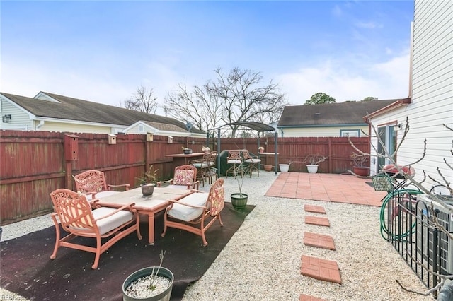 view of patio featuring outdoor dining space and a fenced backyard