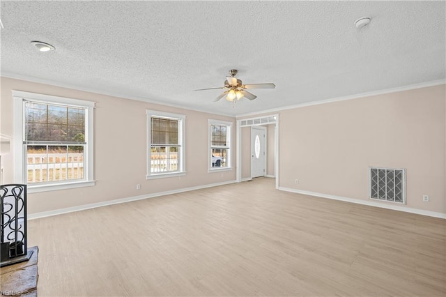 unfurnished living room featuring light wood-type flooring, visible vents, ceiling fan, and crown molding