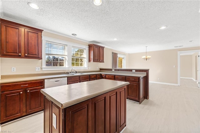 kitchen with a peninsula, a sink, dishwasher, a chandelier, and a center island