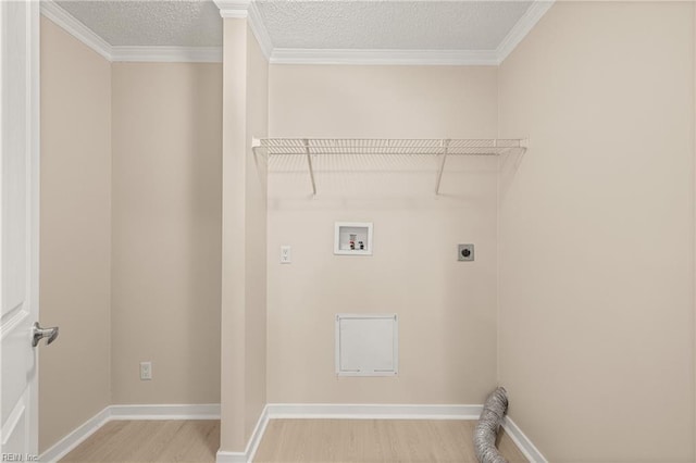 laundry room with washer hookup, a textured ceiling, wood finished floors, hookup for an electric dryer, and laundry area