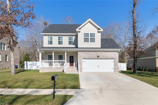 traditional-style house with a front lawn, covered porch, concrete driveway, a garage, and brick siding