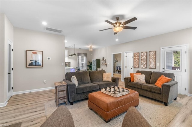 living room with visible vents, recessed lighting, light wood-style floors, baseboards, and ceiling fan