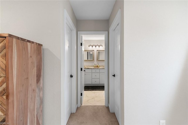 corridor with light colored carpet