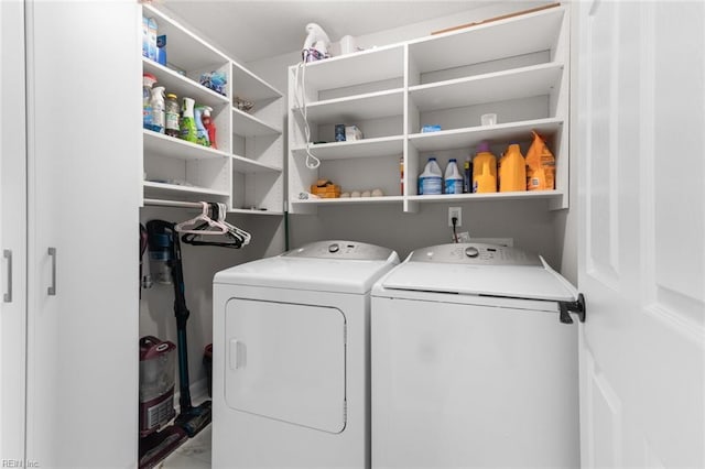 laundry area with washer and clothes dryer and laundry area