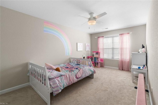 carpeted bedroom with visible vents, ceiling fan, and baseboards