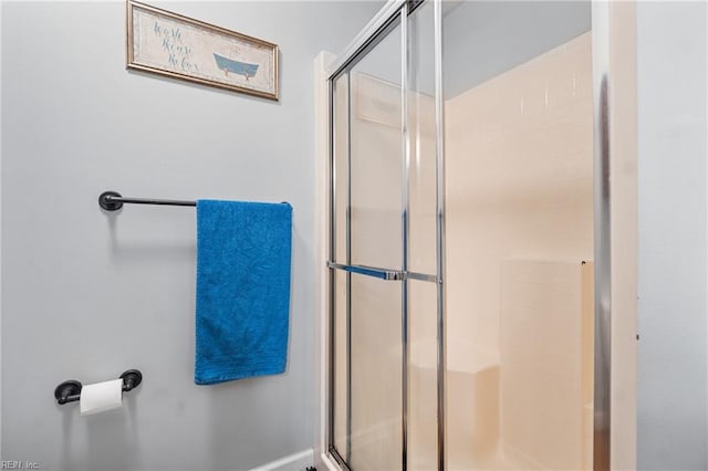 bathroom featuring a shower stall