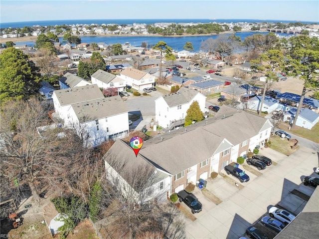 bird's eye view featuring a water view and a residential view