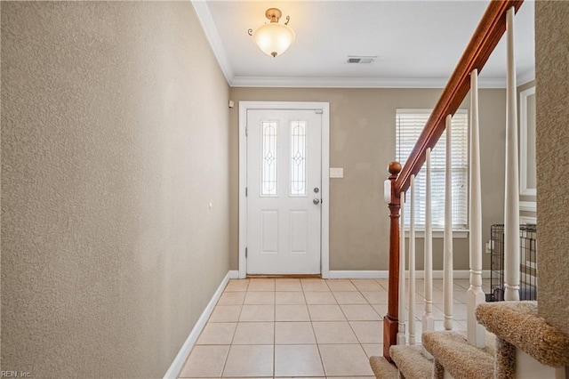 entryway with visible vents, ornamental molding, stairway, light tile patterned floors, and baseboards