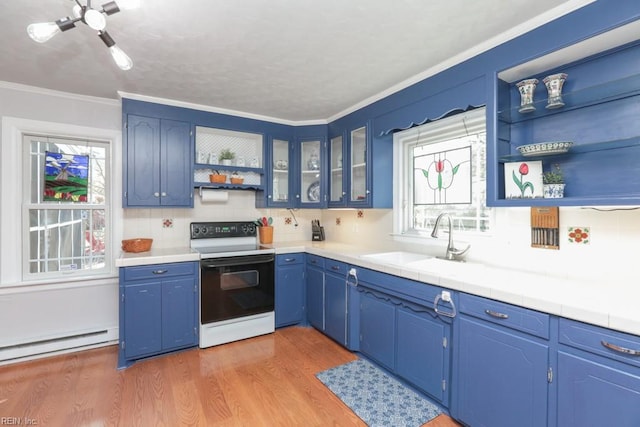 kitchen featuring open shelves, a sink, electric range oven, light wood-style floors, and baseboard heating