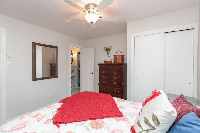 bedroom with a closet, ensuite bath, and a ceiling fan