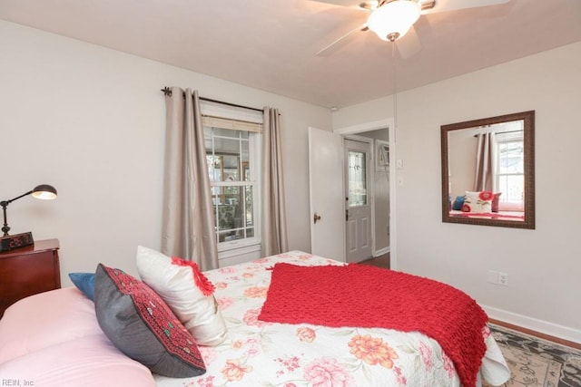 bedroom with baseboards and ceiling fan