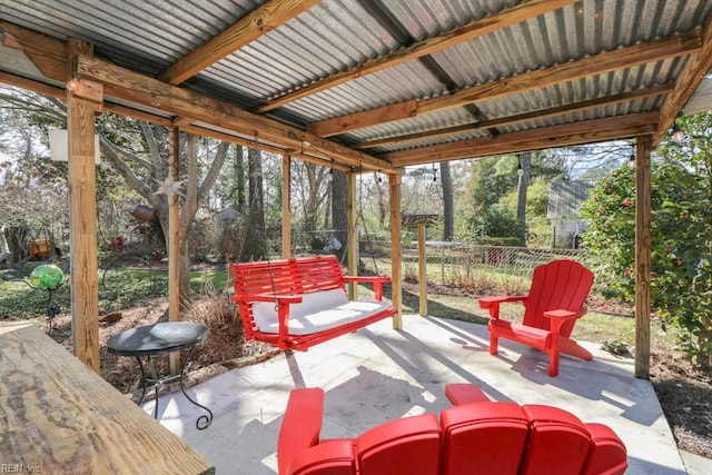 view of patio / terrace featuring fence