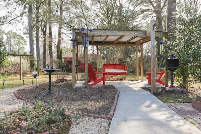 view of community featuring a patio area and fence