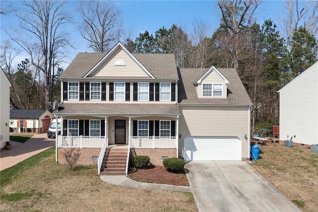 view of front facade with covered porch, a shingled roof, concrete driveway, a front lawn, and crawl space