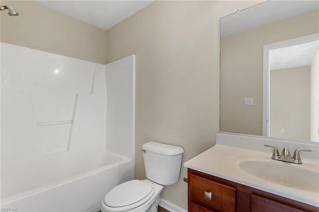 bathroom featuring bathing tub / shower combination, toilet, and vanity