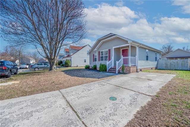 view of front facade with fence and crawl space