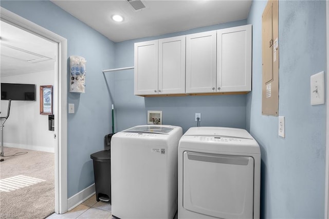 clothes washing area with baseboards, visible vents, cabinet space, light carpet, and washer and clothes dryer