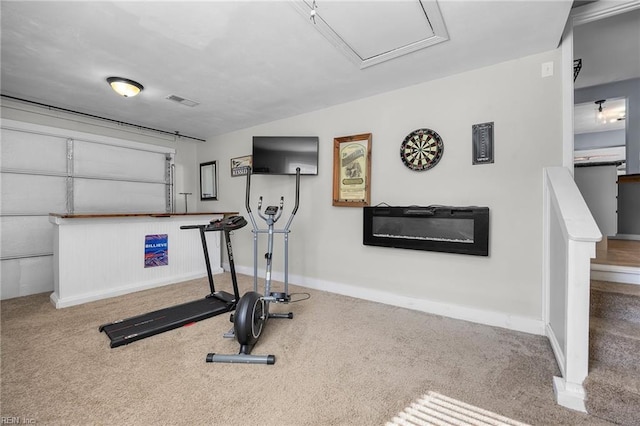 workout room featuring visible vents, baseboards, and carpet