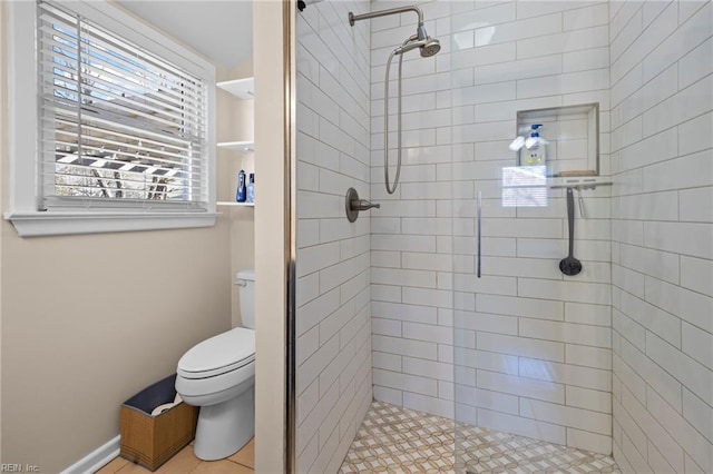 full bathroom featuring toilet and a shower stall