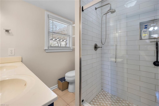 full bathroom featuring tile patterned floors, toilet, a stall shower, a sink, and double vanity