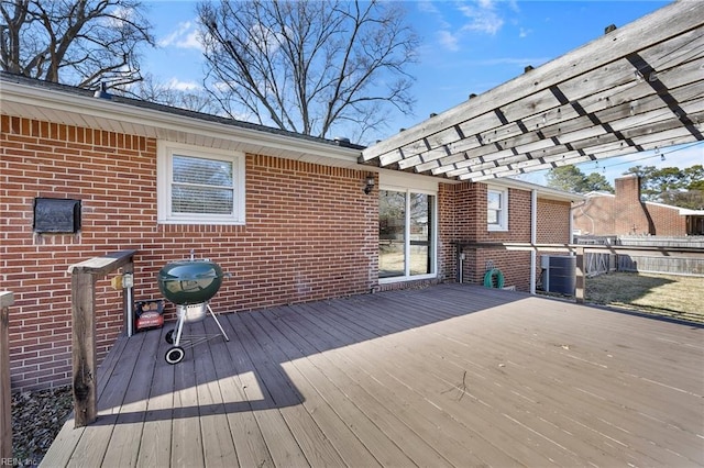 deck featuring area for grilling and cooling unit