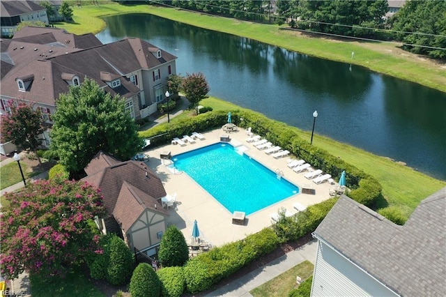 community pool featuring a patio area and a water view