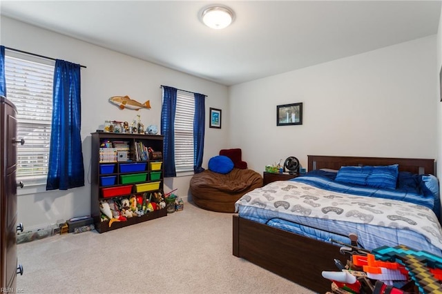 bedroom featuring baseboards and carpet floors