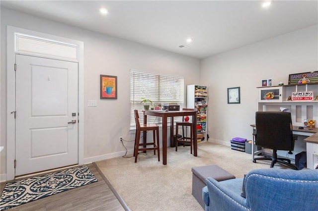 office space featuring visible vents, recessed lighting, baseboards, and wood finished floors