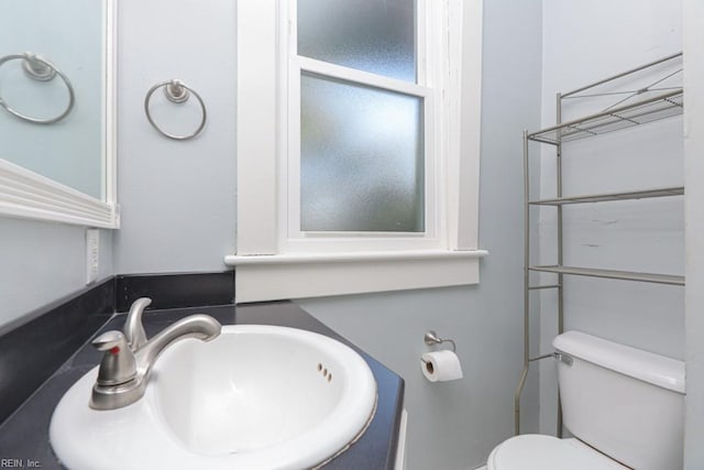 bathroom featuring toilet and a sink