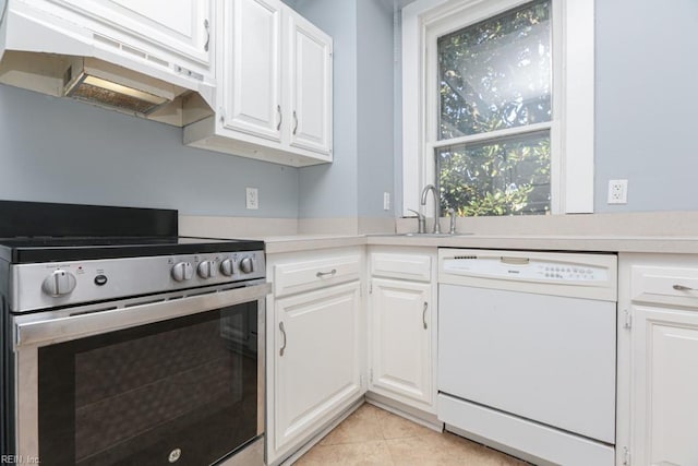 kitchen with under cabinet range hood, dishwasher, stainless steel electric range, white cabinets, and a sink