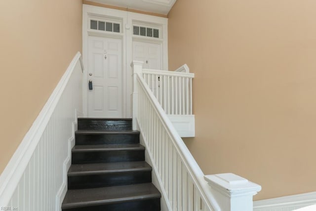 stairs with a decorative wall