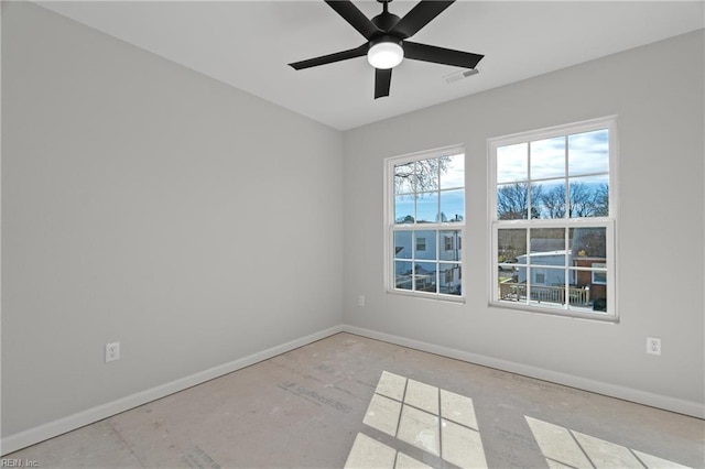 unfurnished room featuring visible vents, ceiling fan, and baseboards