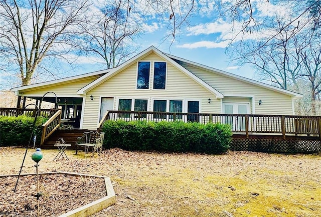 back of property featuring a wooden deck