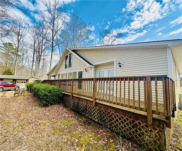 back of property with a wooden deck