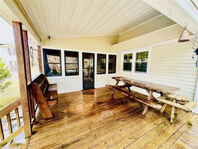 sunroom with wooden ceiling and lofted ceiling