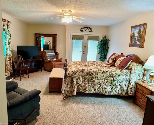 carpeted bedroom featuring french doors, a textured ceiling, a ceiling fan, and access to outside