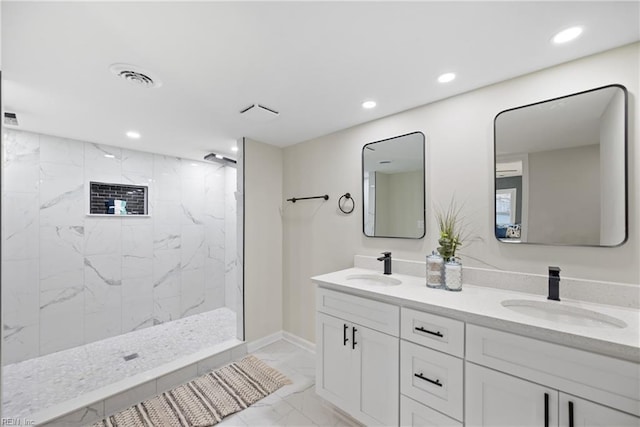 full bathroom with recessed lighting, marble finish floor, and a sink