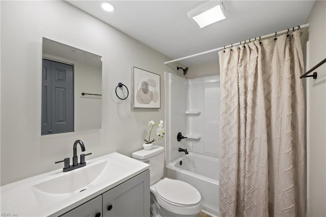 full bath featuring shower / tub combo with curtain, toilet, and vanity