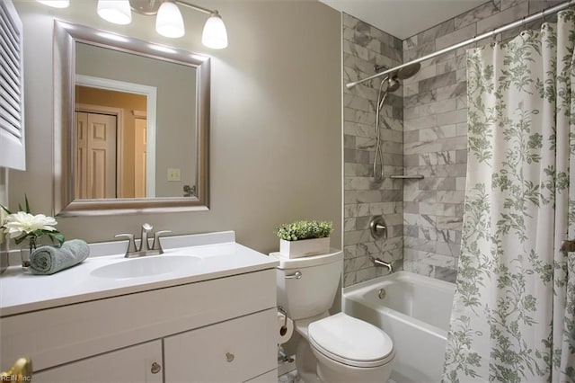 bathroom with vanity, toilet, and shower / tub combo